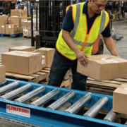 man using ultimation gravity conveyor